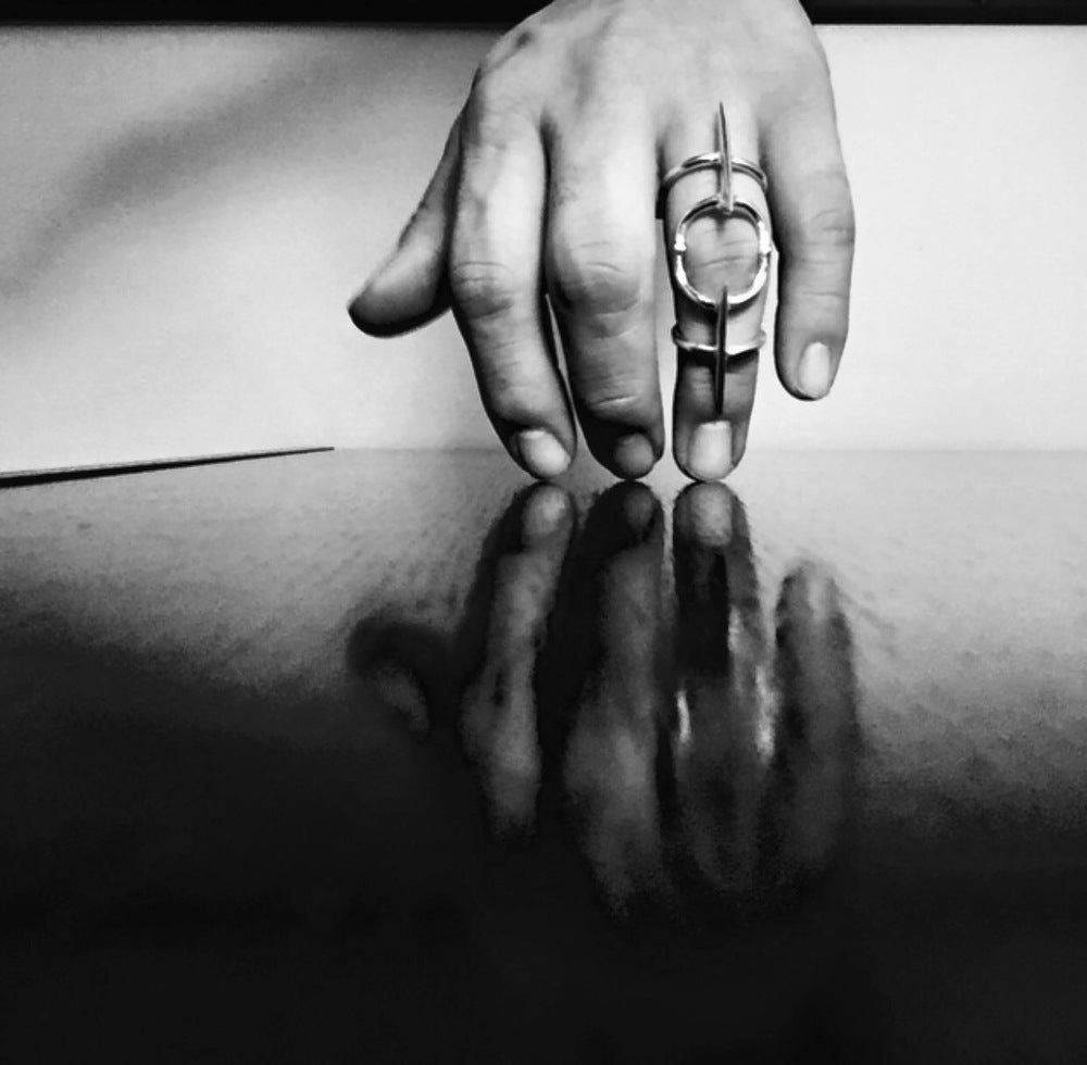 THE ARTICULATED SCYTHE FINGERBRACE RING